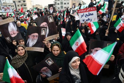 Iranian pro-government protesters attend a demonstration in Tehran